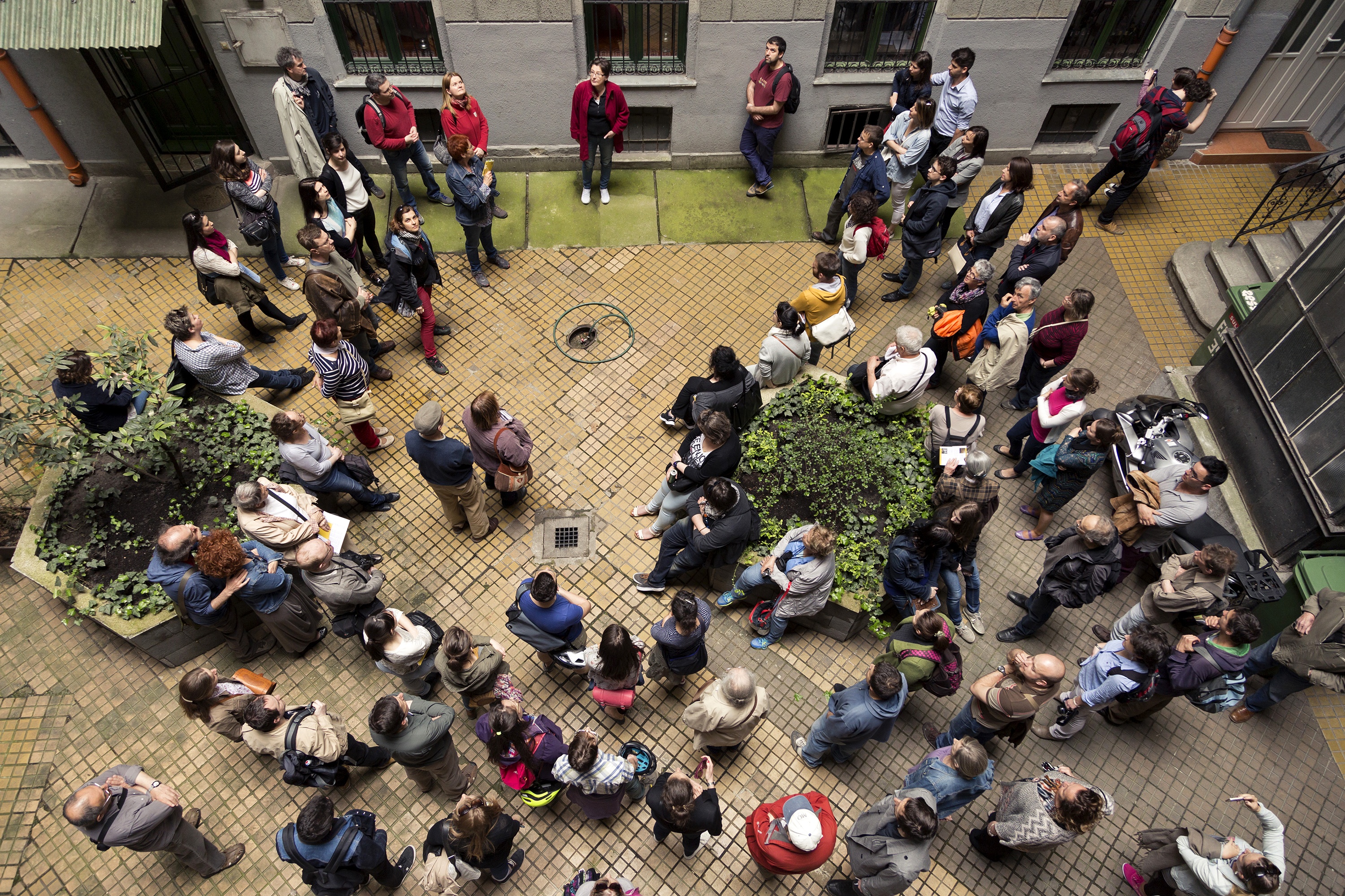 Gathering in the patio of one centennial house listening to stories about the building.