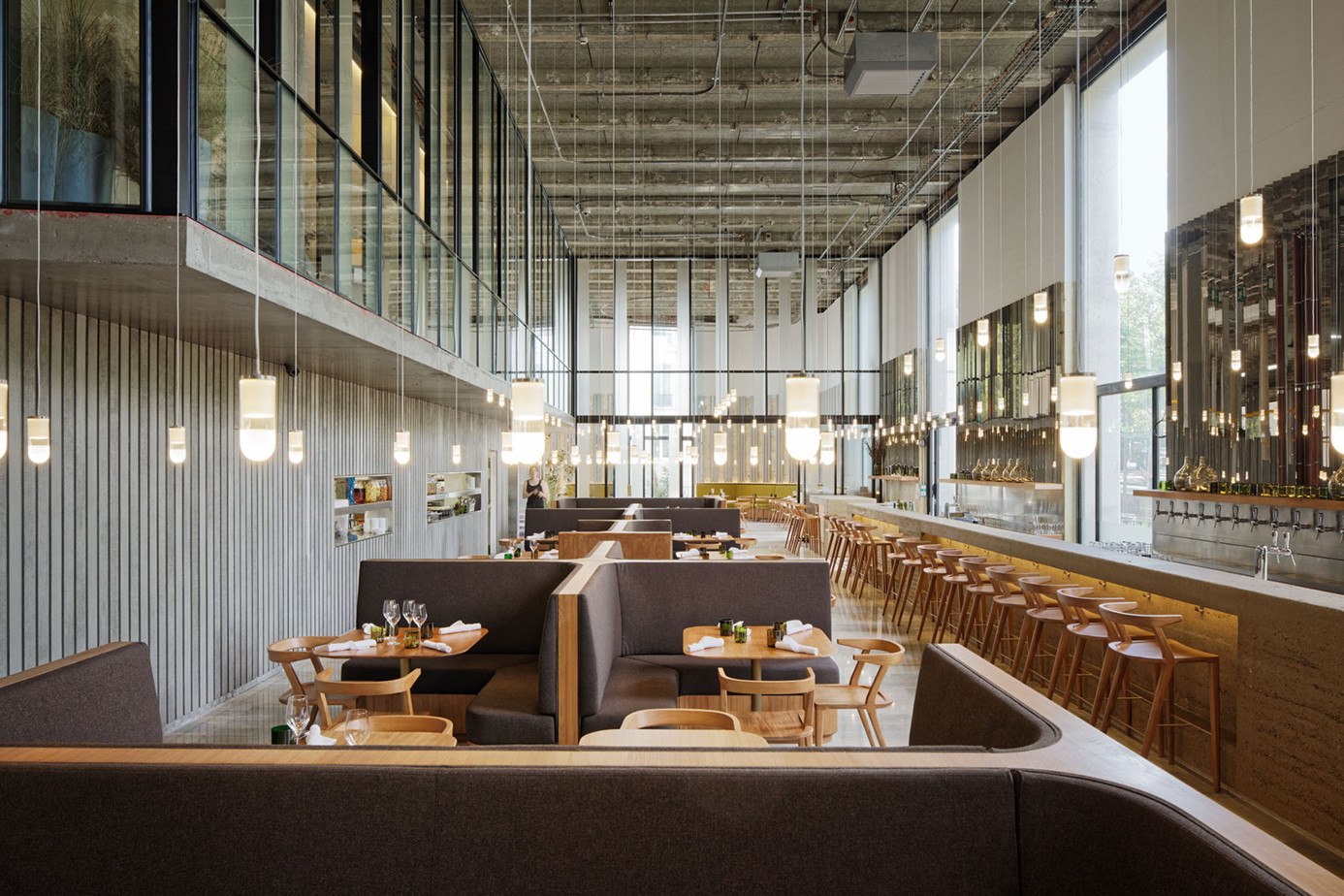 Les Grands Verres bar and restaurant in Paris, at Palais de Tokyo, with rammed earth and eco-friendly design by Lina Ghotmeh. Copyright: Takuji Shimmura.